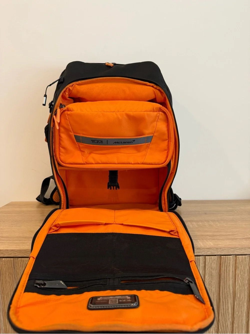 Tumi Black and Orange Men's Backpack with Detachable Travel Pouch
